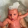 baby, child, bath, foam, bubbles, water, skin, face, expression, arm, tattoo, funny_face, wet, head, infant, naked, playful, cute, support, human