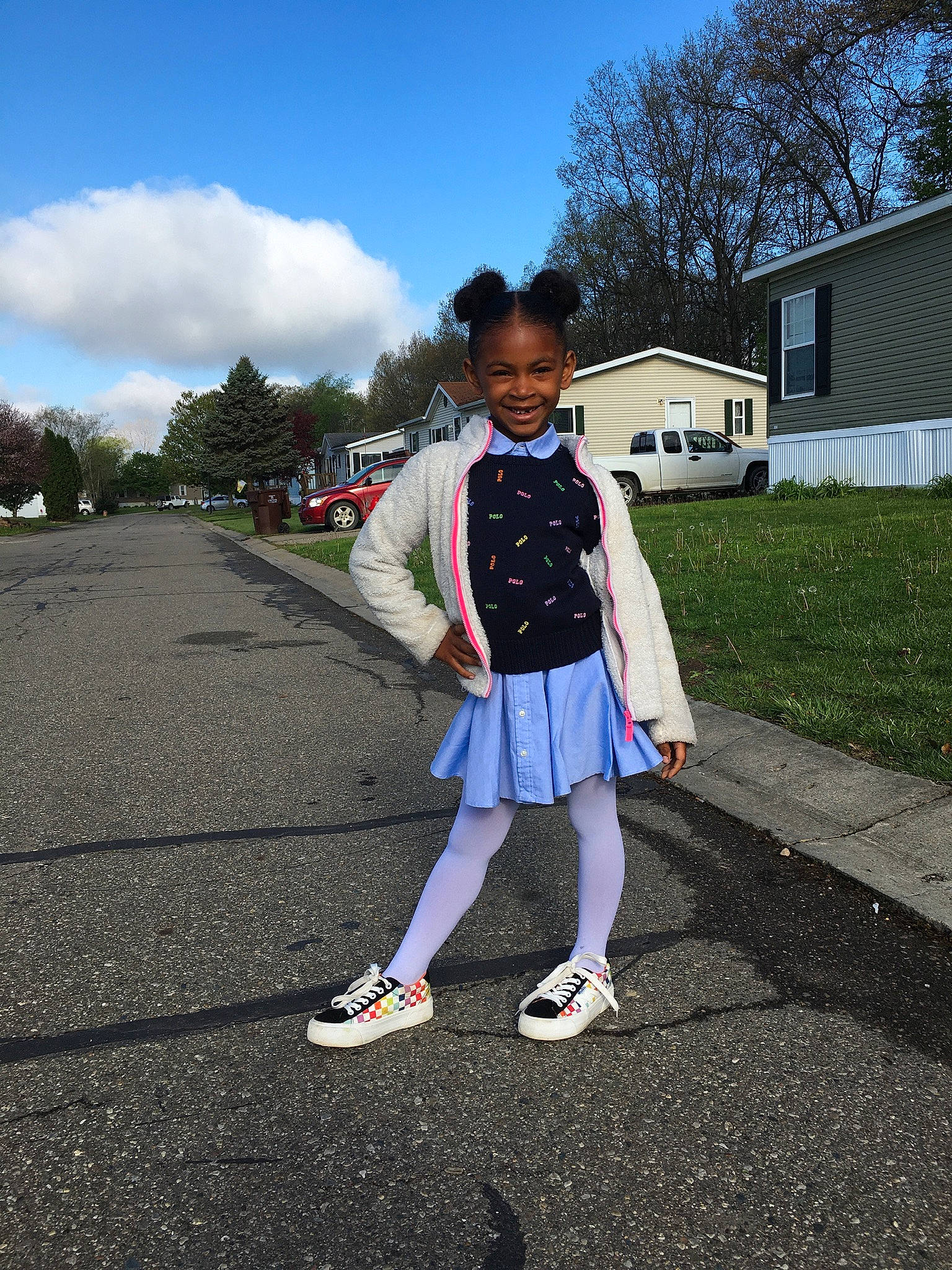 Zalia is registered to the contest to win money with this photo: asphalt, cloud, denim, electric_blue, footwear, joy, leisure, person, plaid, plant, public_space, road, road_surface, school_uniform, shorts, sky, sneakers, street_fashion, toddler, travel