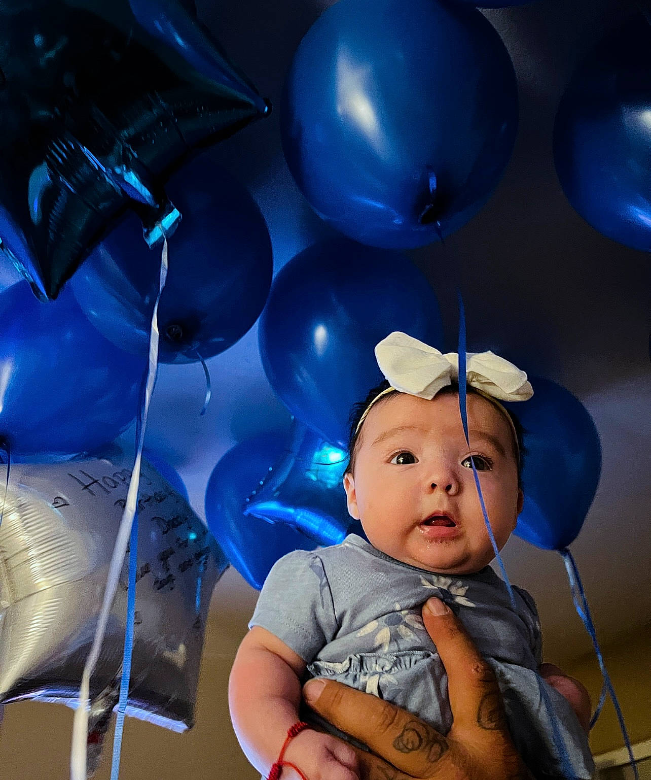 Jhene is registered to the contest to win money with this photo: azure, baby, baby_products, baby_toddler_clothing, balloon, blue, child, cloud, electric_blue, event, fashion_accessory, flash_photography, fun, happy, hat, party_supply, person, sitting, sky, space