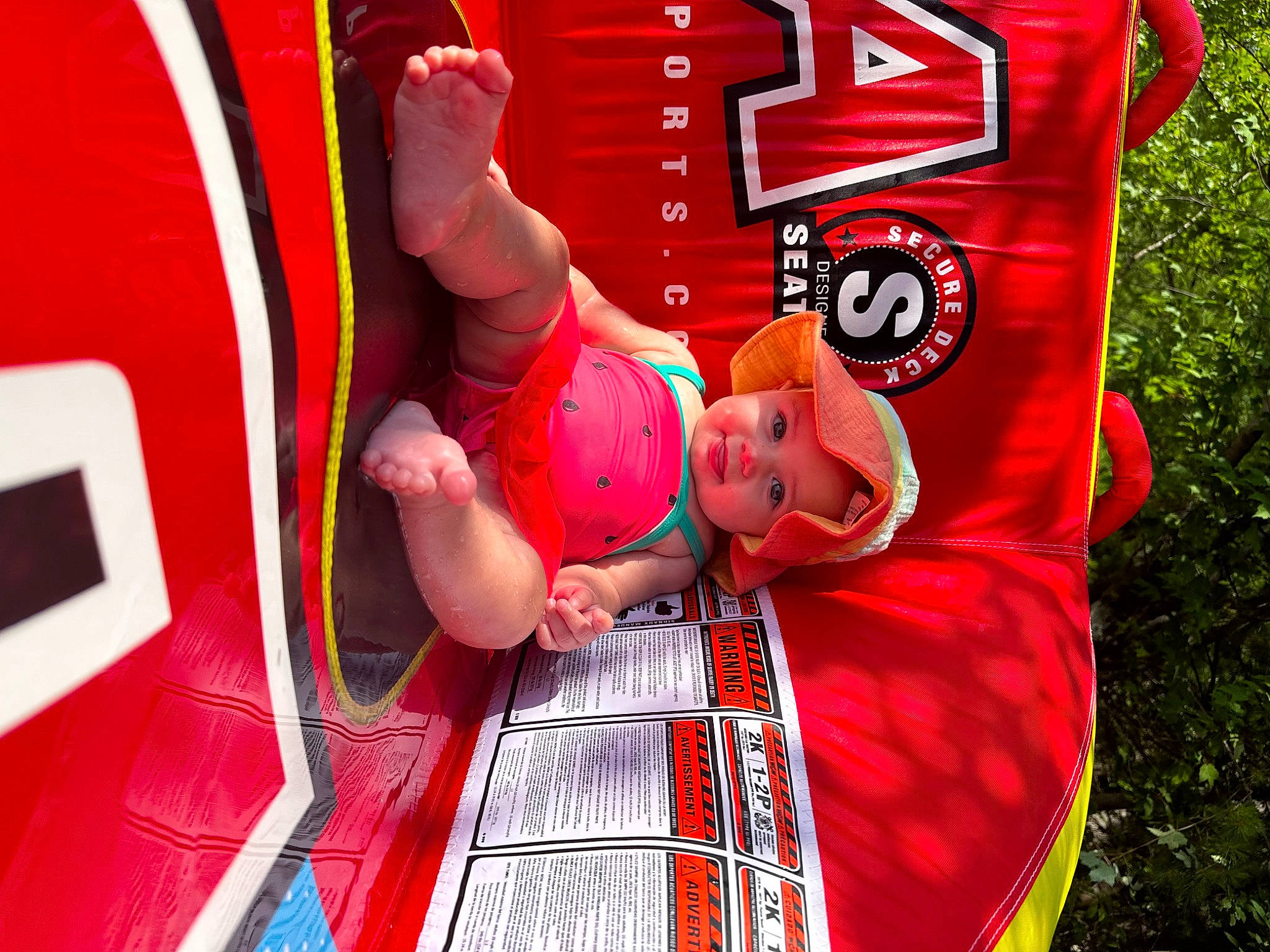 Demi joined the competition — help win amazing prizes! advertising, automotive_exterior, automotive_tire, baby, child, design, event, fictional_character, fun, grass, headwear, leisure, motor_vehicle, person, pink, recreation, red, shorts, t_shirt, tire