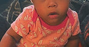 Janelle joined the competition — help win amazing prizes! baby, child, towel, bow, onesie, pink, blanket, indoor, cute, portrait, sitting, clothing, infant, face, headwear, expression, cozy, young, person, adorable