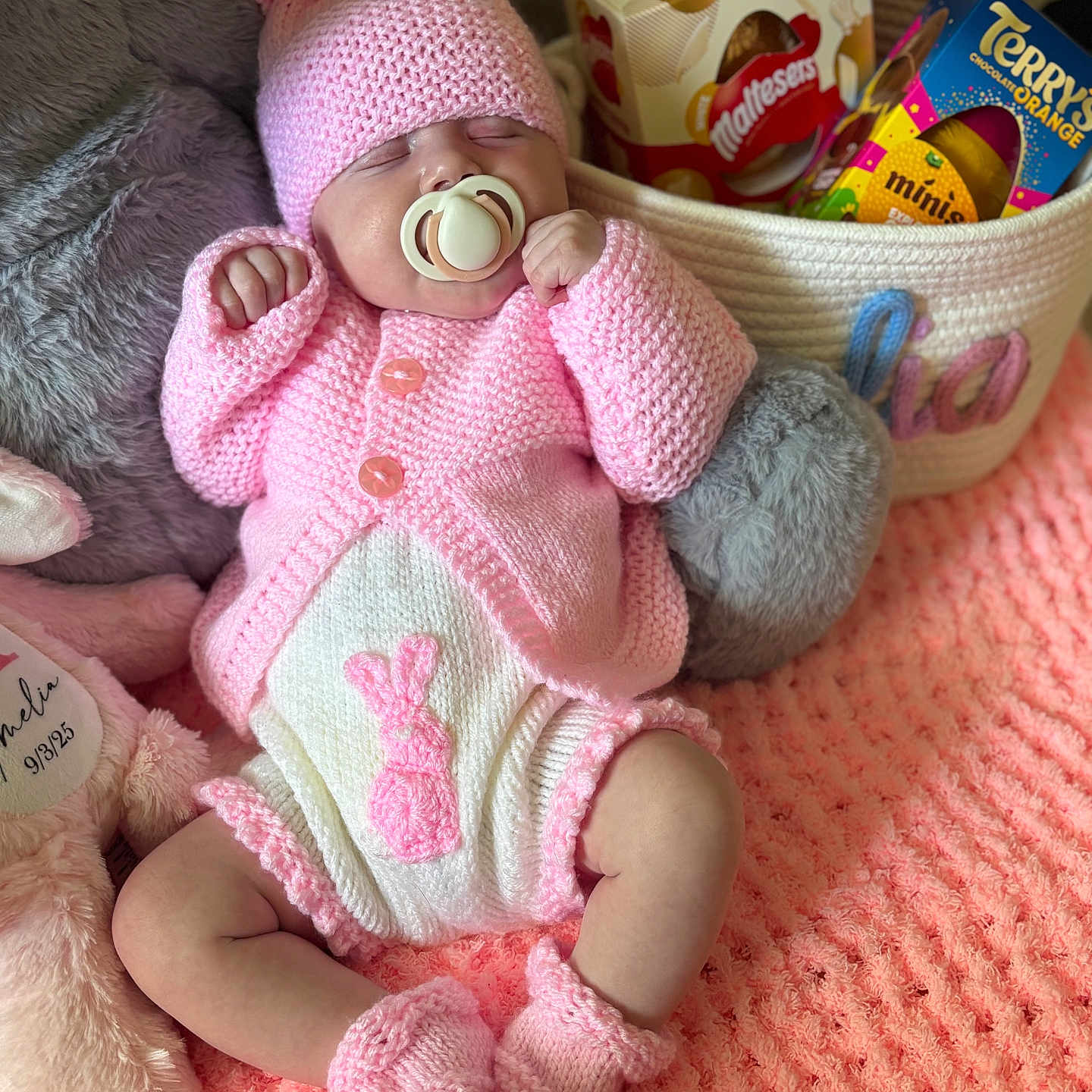 Amelia joined the competition — help win amazing prizes! baby, basket, blanket, booties, chocolate, cozy, cute, decor, easter_theme, handmade, hat, indoor, infant, knitted_clothing, pacifier, pink, plush_toy, resting, sleeping, soft_texture
