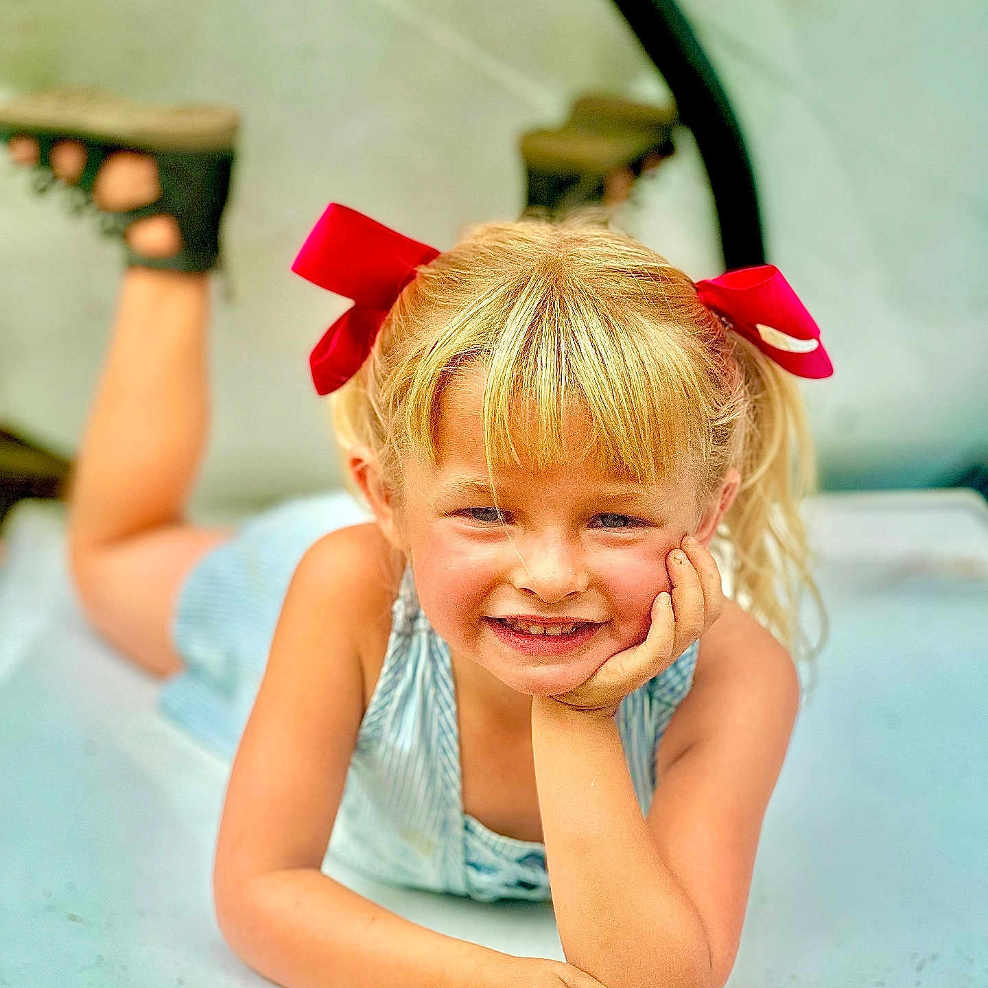 Ayvahlen joined the competition — help win amazing prizes! blonde_hair, casual, child, clothing, cute, face, feet, girl, hand, happy, outdoor, person, playful, portrait, posing, red_bow, resting, shoes, smiling, youth