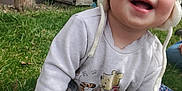Skylar joined the competition — help win amazing prizes! baby, backyard, clothing, coat, crawling, face, grass, happy, hat, head, jacket, nature, outdoors, pants, person, photography, plant, portrait, tree, yard