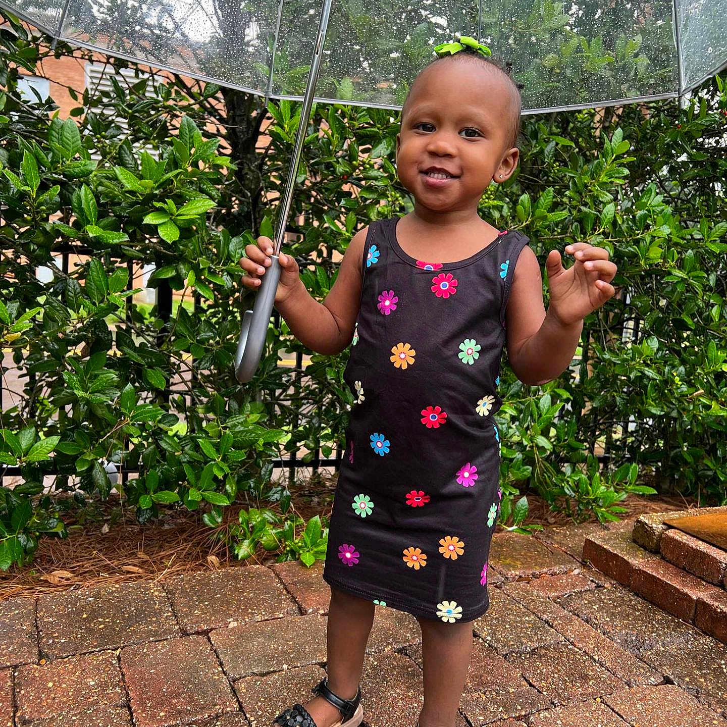 Kaylani is registered to the contest to win money with this photo: architecture, building, clothing, face, footwear, head, herbal, herbs, outdoors, path, person, photography, plant, portrait, pottedplant, sandal, shelter, soil, summer, walkway