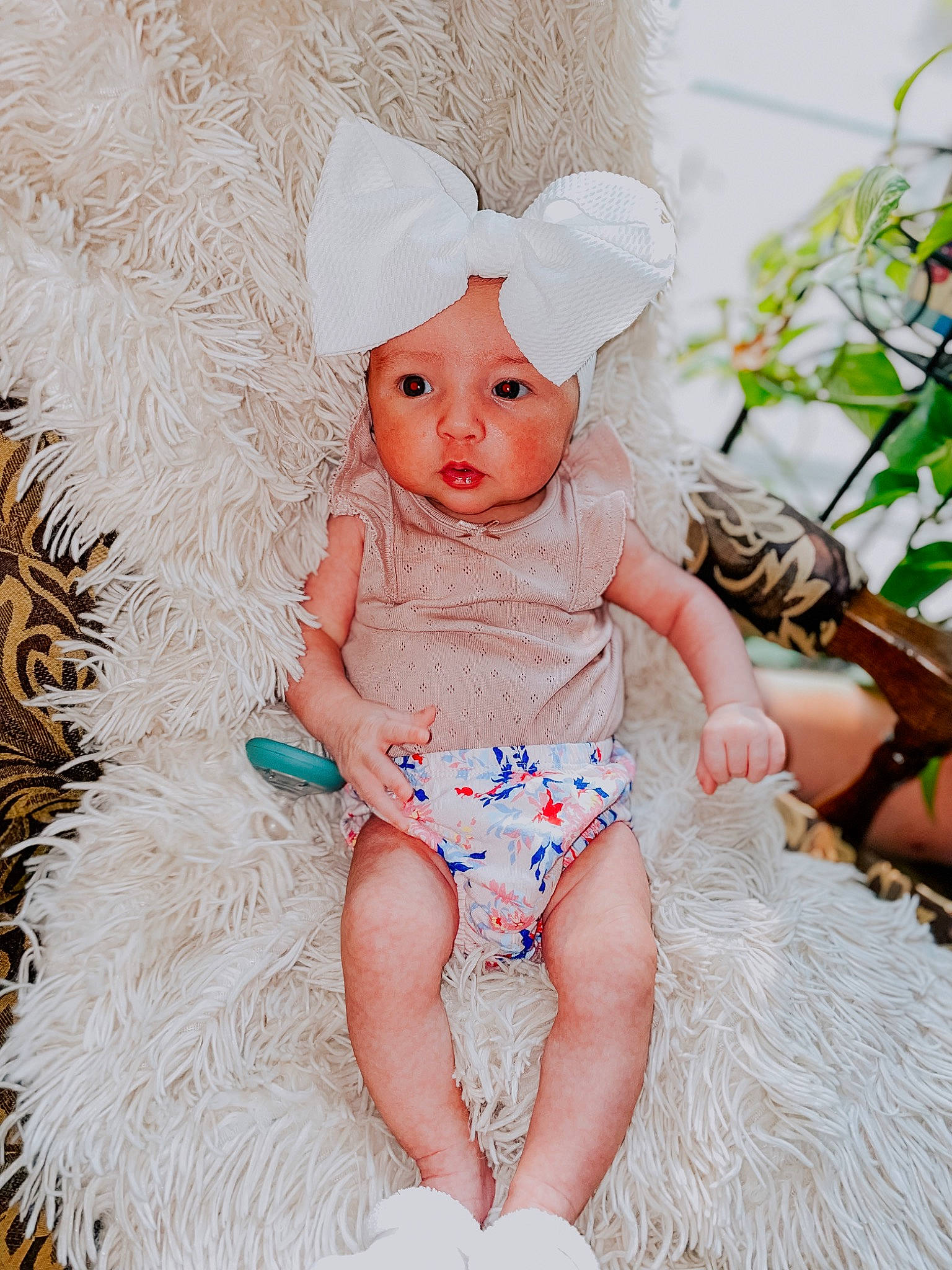 Aspyn is registered to the contest to win money with this photo: baby, baby_toddler_clothing, cheek, child, embellishment, eye, fashion_accessory, foot, happy, headband, headwear, iris, mythical_creature, pattern, peach, person, pink, plant, sitting, skin