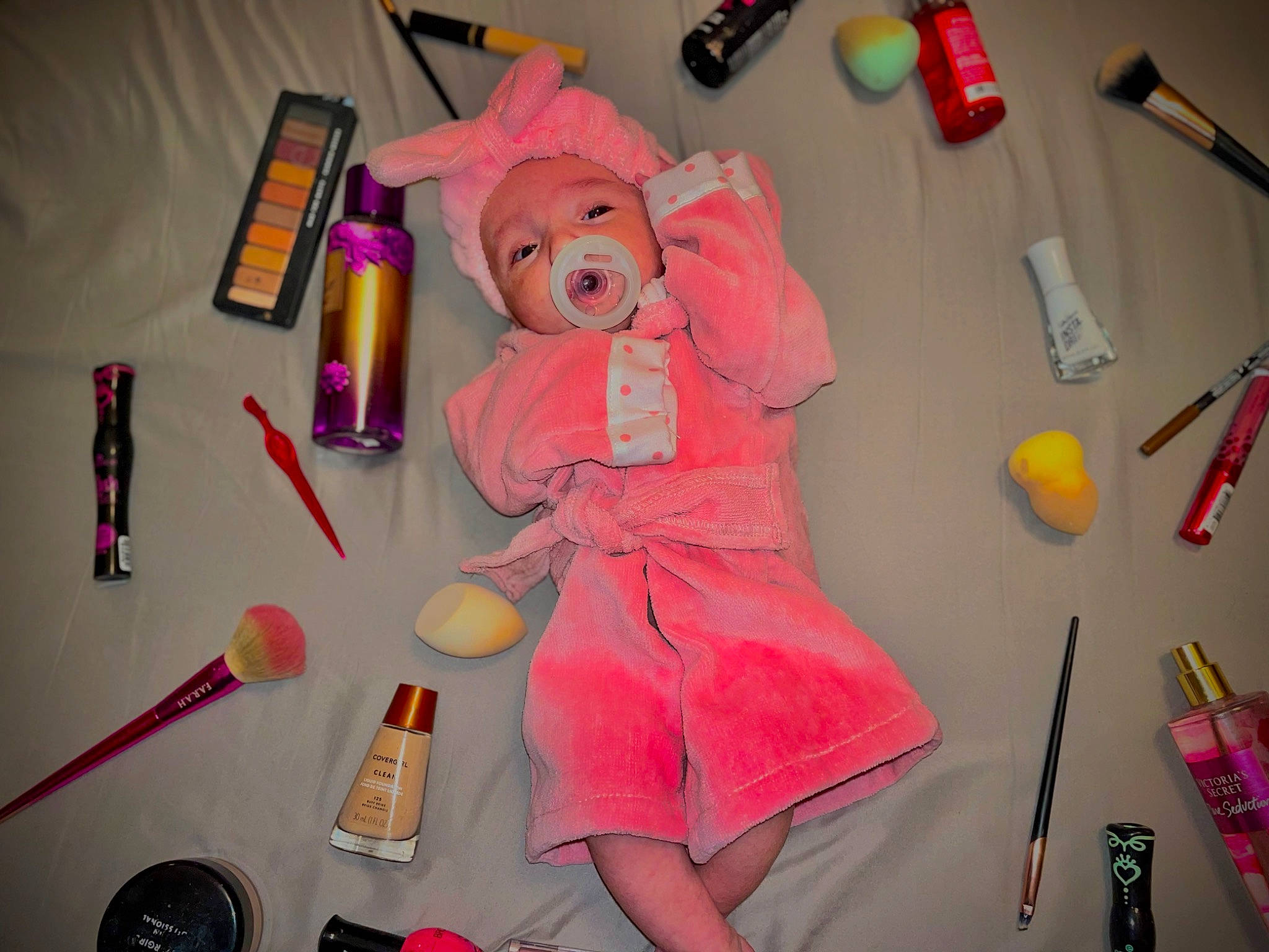 Aspyn is registered to the contest to win money with this photo: art, brush, event, hat, headwear, magenta, material_property, office_supplies, paper, peach, pen, person, personal_care, pink, plastic, product, room, stationery, stuffed_toy, toy