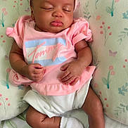 Janyla is registered to the contest to win money with this photo: baby, bed, blanket, bonnet, clothing, cushion, face, furniture, glove, hat, head, homedecor, hosiery, newborn, person, photography, portrait, quilt, sleeping, sock