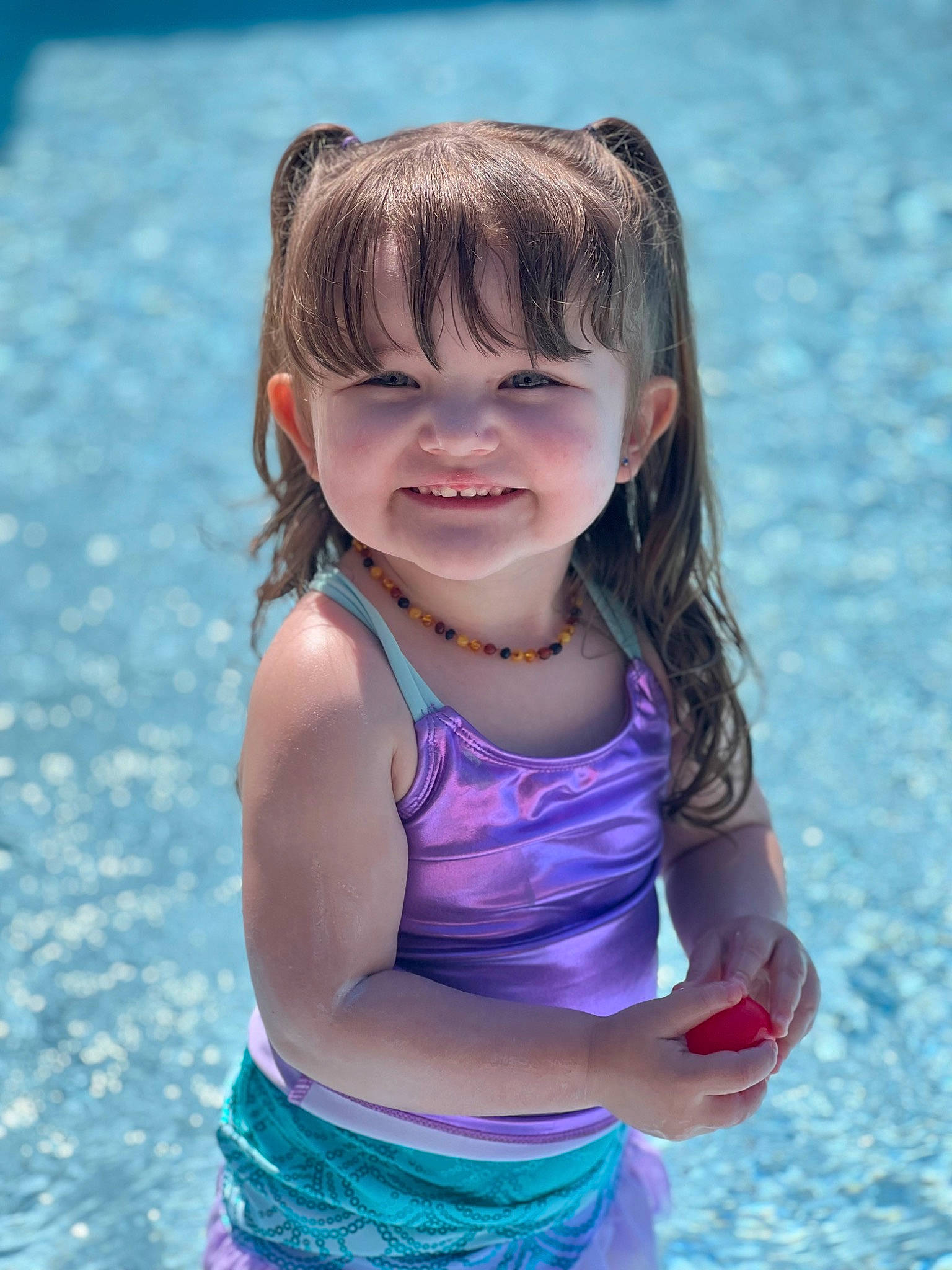 Sophie is registered to the contest to win money with this photo: azure, beauty, body_of_water, child, electric_blue, eye, fun, happy, joy, leisure, people_in_nature, people_on_beach, person, photograph, pink, recreation, smile, summer, swimming_pool, swimwear
