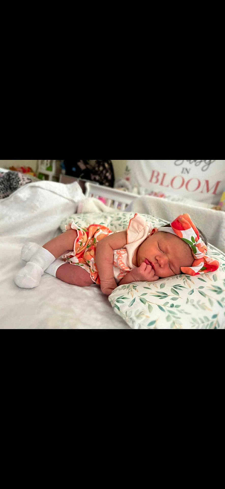 Kaliya joined the competition — help win amazing prizes! newborn, baby, sleeping, headband, floral, pillow, blanket, crib, nursery, infant, cute, resting, clothing, soft, cozy, child, person, indoors, peaceful, portrait