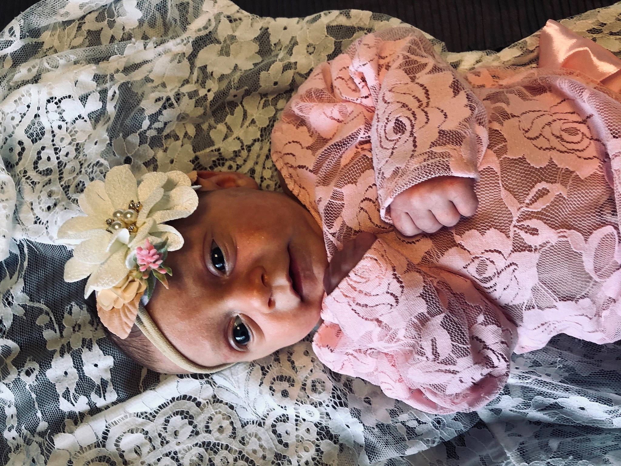 Rylann is registered to the contest to win money with this photo: art, baby, child, dress, eye, eyelash, flower, hair_accessory, hat, head, headgear, headpiece, headwear, person, petal, pink, skin, sun_hat, textile, toddler