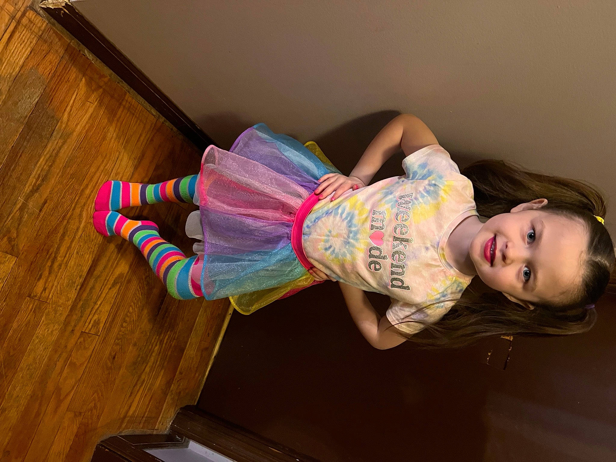 Madalye is registered to the contest to win money with this photo: child, flash_photography, flooring, foot, fun, hairstyle, happy, hardwood, human_body, human_leg, joy, knee, leg, magenta, person, pink, skin, smile, sock, thigh