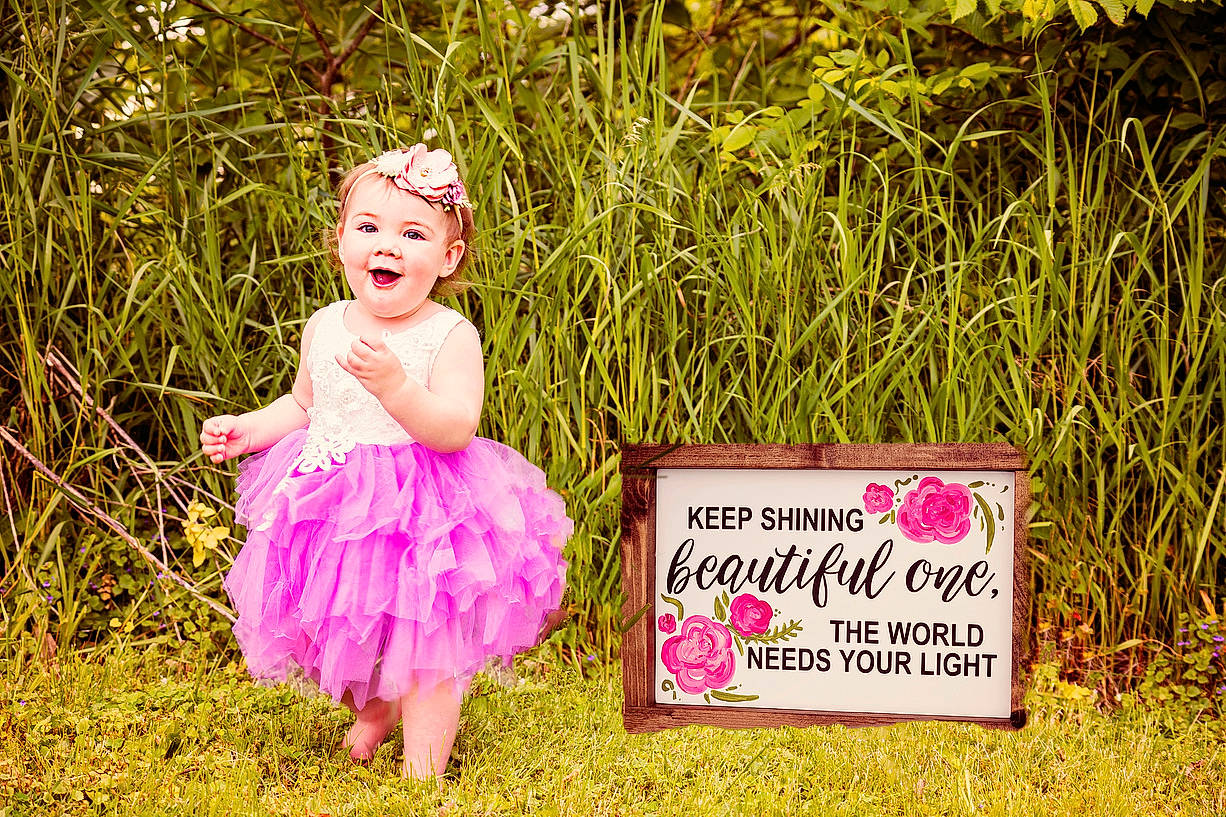 Colette joined the competition — help win amazing prizes! baby, child, costume, dress, fun, grass, happy, headwear, joy, person, photograph, photography, pink, plant, smile, toddler, yellow