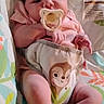 baby, infant, pacifier, diaper, monkey_design, pink_clothing, lying_down, portrait, face, hands, feet, blanket, crib, nursery, indoor, close_up, awake, serious_expression, baby_bedding, photograph
