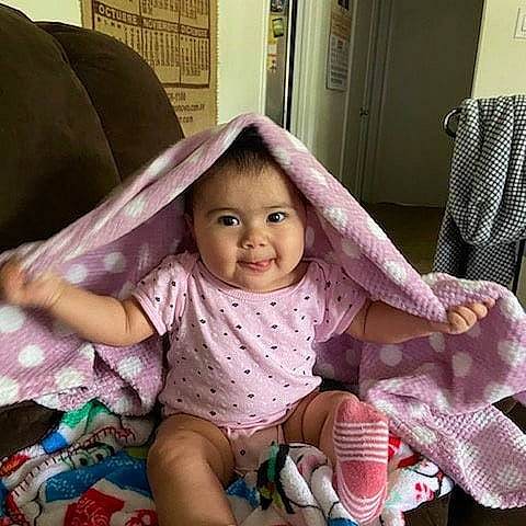 Alejandra joined the competition — help win amazing prizes! baby, beauty, cheek, child, design, eye, face, footwear, head, joy, lip, nose, people, person, pink, play, product, sitting, skin, smile