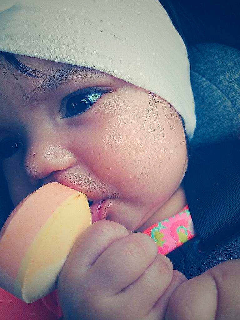 Elyanna is registered to the contest to win money with this photo: baby, beauty, blue, cheek, child, close_up, eye, eyebrow, face, finger, hand, head, headgear, lip, mouth, nose, person, pink, skin, smile