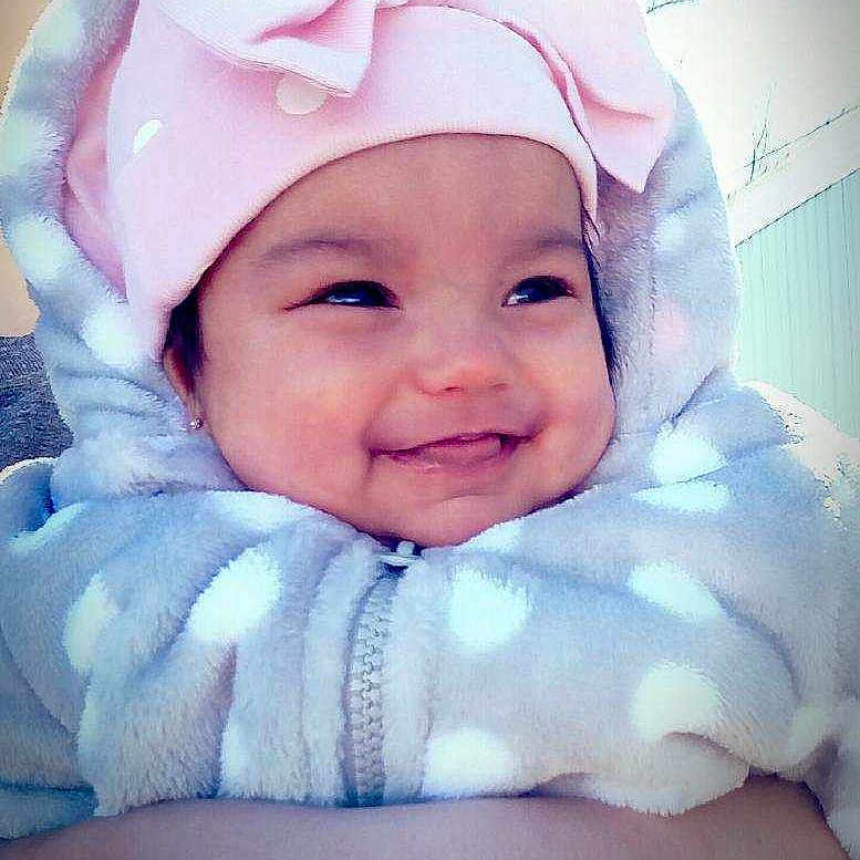 Elyanna is registered to the contest to win money with this photo: baby, cheek, child, face, happy, head, headgear, headwear, joy, person, pink, skin, smile, toddler