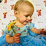 toddler, child, flower, dandelion, dress, blue, striped, pattern, strawberry, blanket, calf, animal_print, smiling, happy, indoor, person, cute, sitting, baby, portrait
