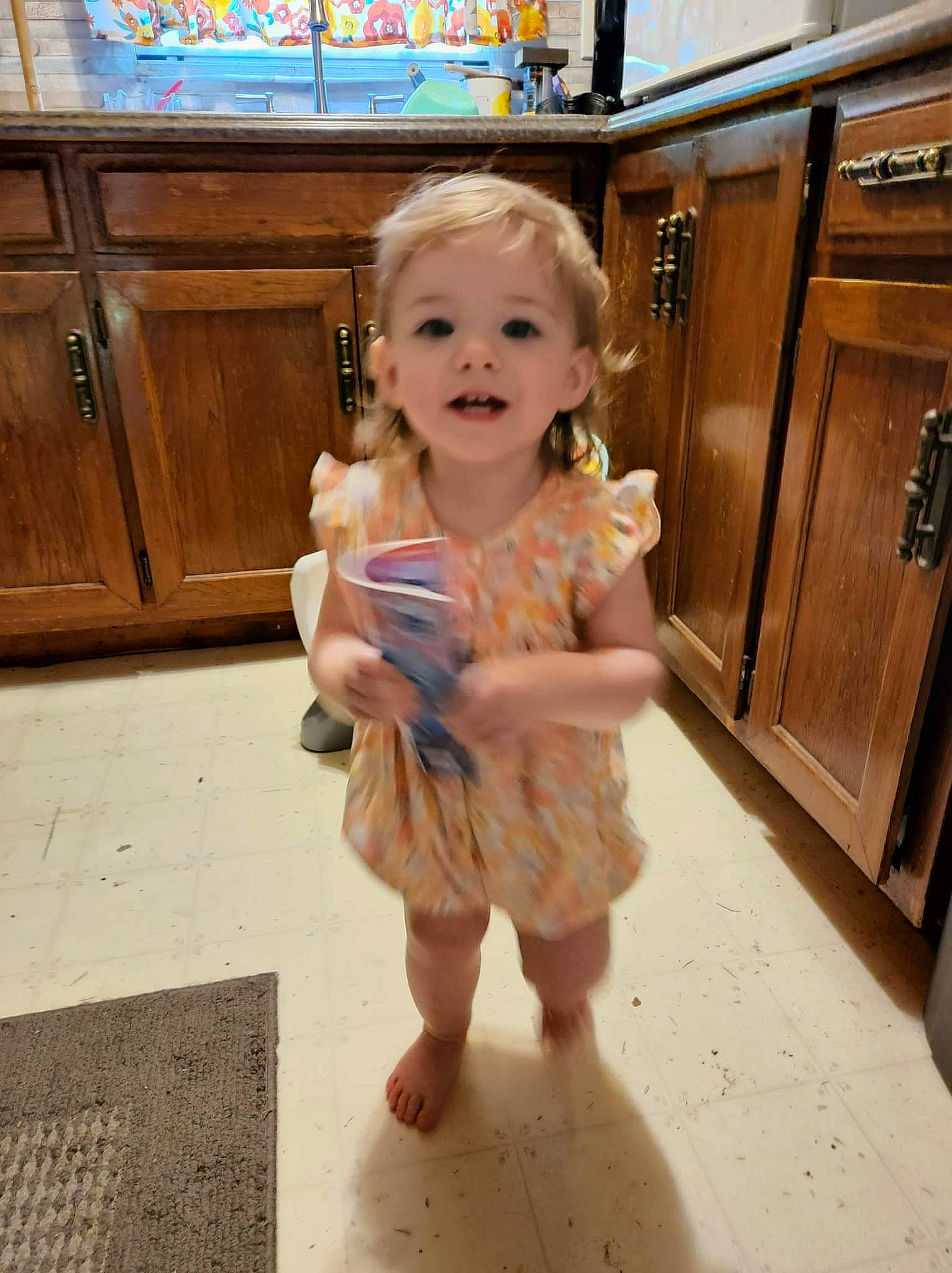 Ashton joined the competition — help win amazing prizes! baby, cabinetry, child, cupboard, drawer, eye, floor, flooring, foot, fun, happy, hardwood, human_leg, person, play, sitting, skin, smile, thumb, toddler