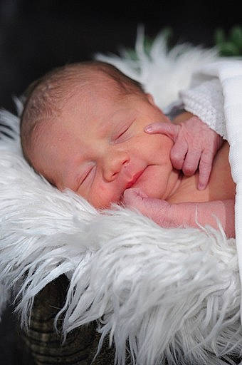 King is registered to the contest to win money with this photo: baby, beauty, cheek, child, close_up, comfort, ear, eye, eyebrow, eyelash, finger, fur, gesture, hand, happy, head, iris, nose, person, skin