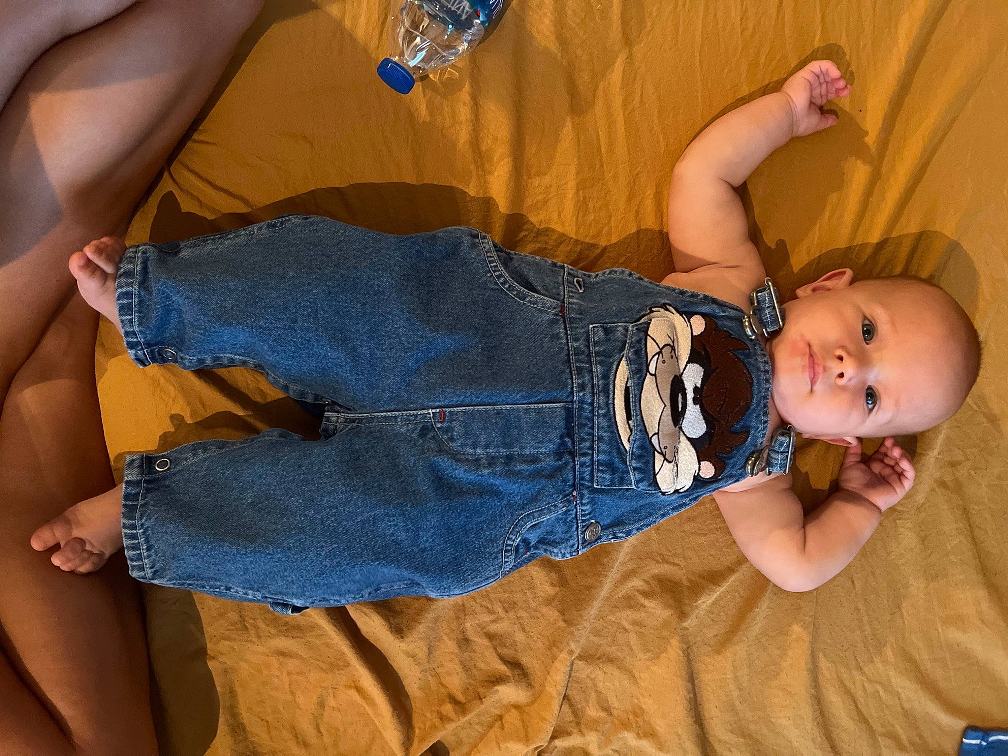 Zephyr is registered to the contest to win money with this photo: abdomen, baby, baby_toddler_clothing, finger, fun, gesture, hat, human_body, jeans, joint, leg, muscle, person, skin, smile, textile, thigh, toddler, trunk, water