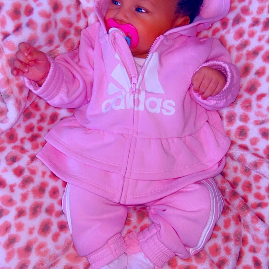 Taliyah joined the competition — help win amazing prizes! baby, blanket, bonnet, clothing, coat, face, glove, hat, head, hood, hoodie, jacket, knitwear, newborn, person, photography, portrait, purple, sweater, sweatshirt