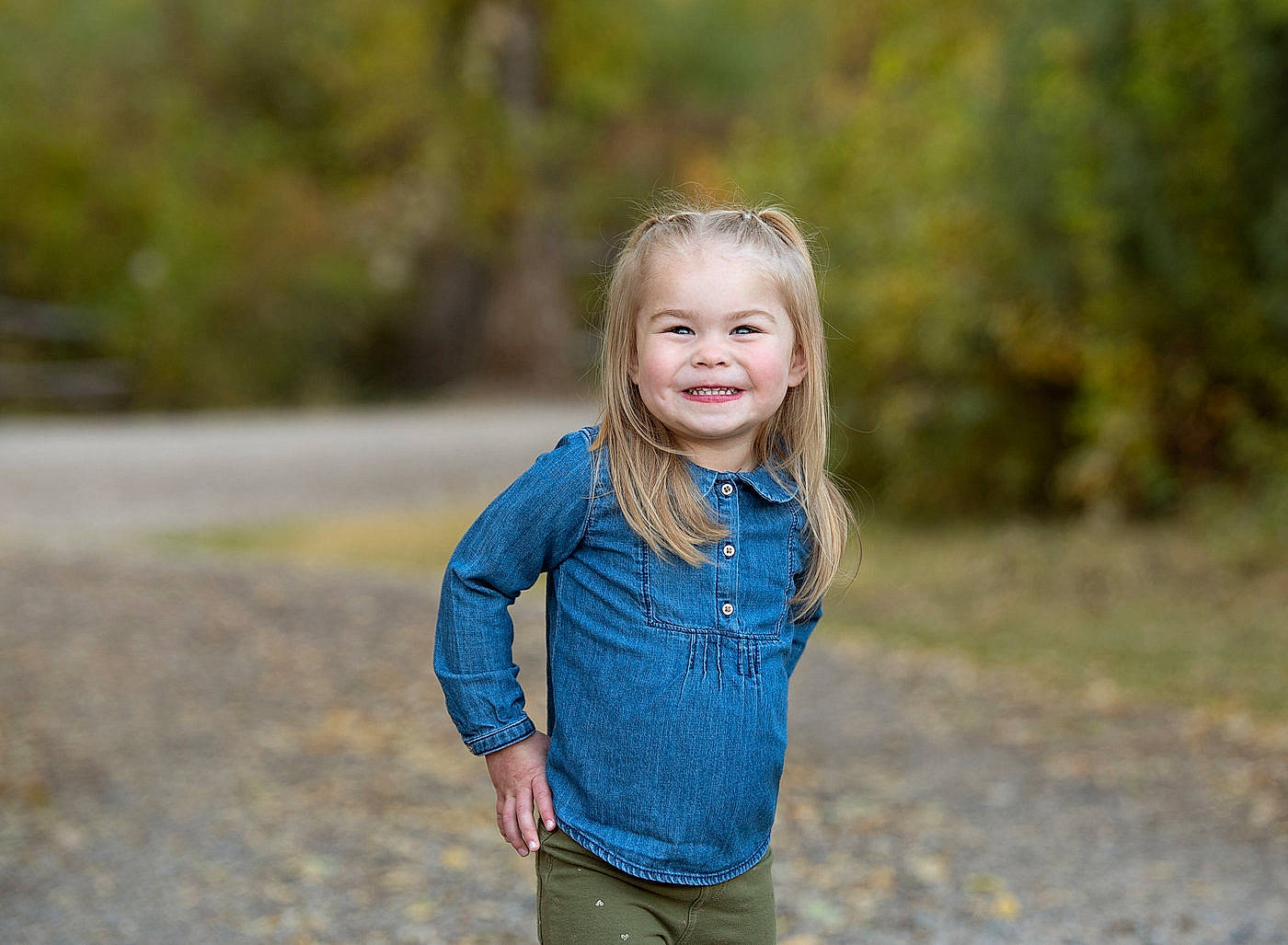 Lila is registered to the contest to win money with this photo: blond, child, denim, electric_blue, flash_photography, forest, grass, grassland, happy, joy, landscape, leisure, outerwear, people_in_nature, person, plant, recreation, smile, t_shirt, toddler