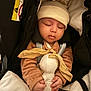Iyad participe au concours pour gagner de l'argent avec cette photo : adorable, baby, beanie, blanket, buckle, car_seat, closed_eyes, clothing, cozy, hands, hat, infant, peaceful, plush, portrait, safety_label, sleeping, soft_texture, stroller, toy