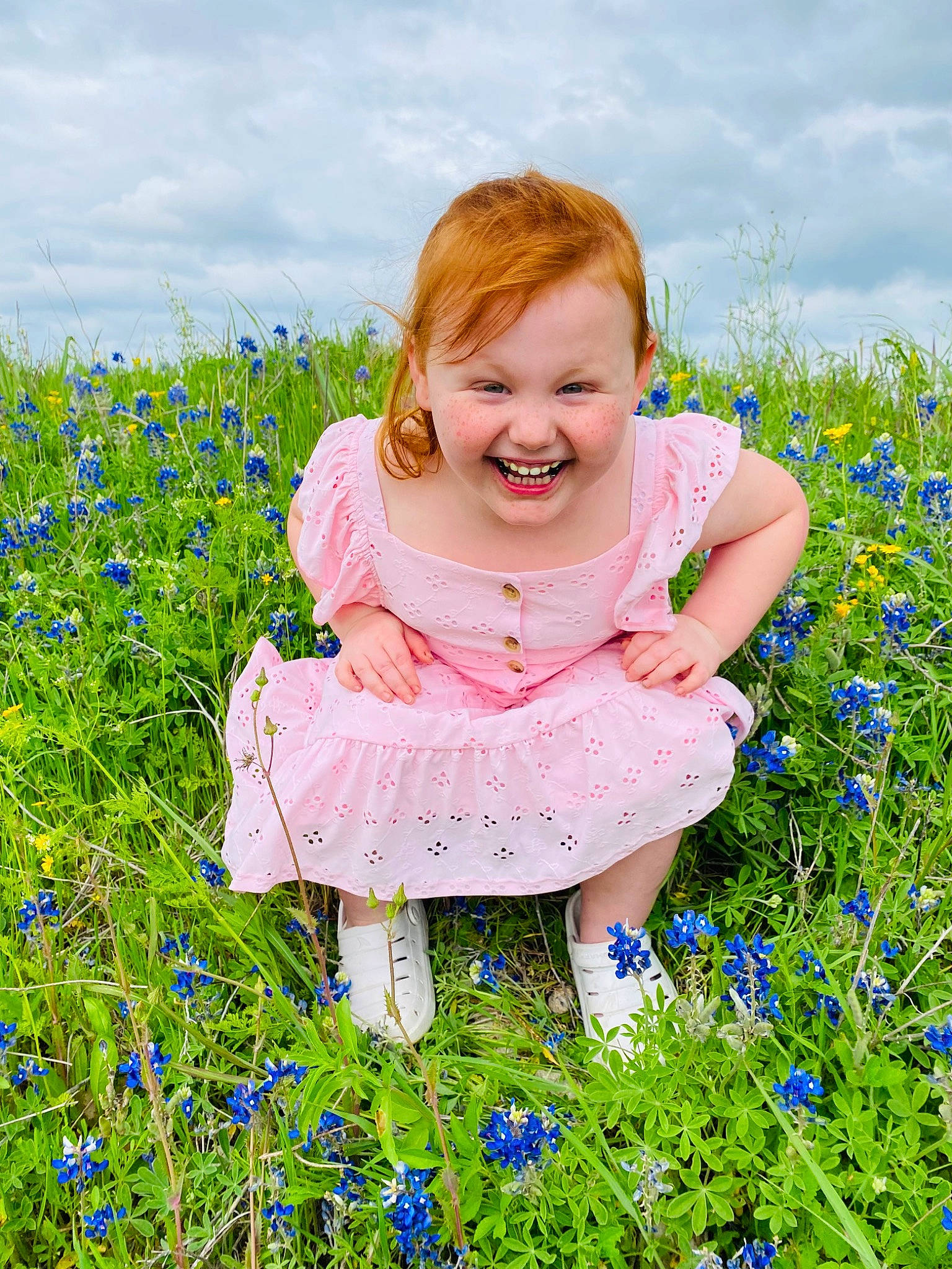 Ashlynn is registered to the contest to win money with this photo: baby_toddler_clothing, beauty, blue, cloud, electric_blue, flower, flowering_plant, grass, grass_family, grassland, groundcover, happy, joy, meadow, natural_landscape, people_in_nature, person, plant, prairie, sky