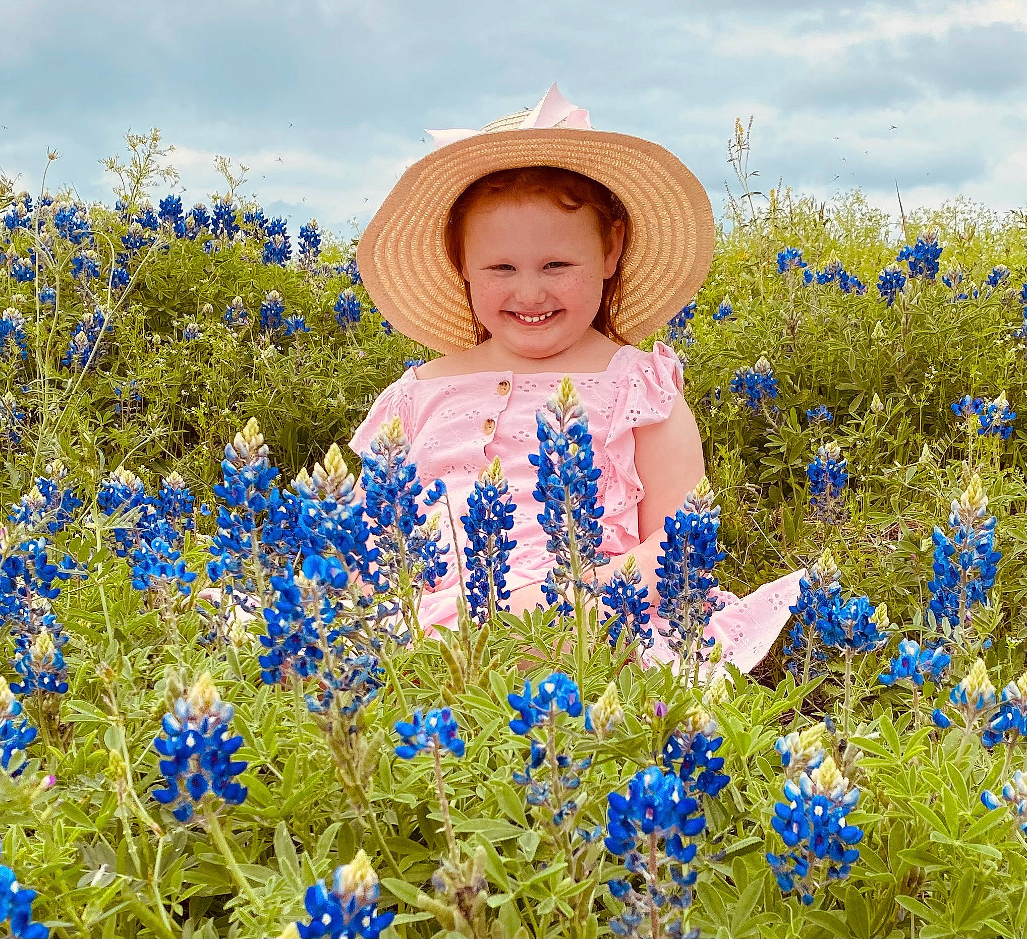 Ashlynn joined the competition — help win amazing prizes! agriculture, blue, cloud, dress, ecoregion, flower, grass, grass_family, grassland, happy, hat, joy, meadow, natural_landscape, people_in_nature, person, petal, plant, sky, smile