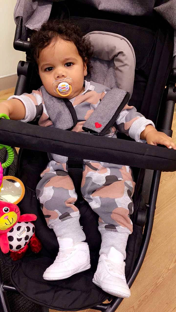 Jaccob is registered to the contest to win money with this photo: baby_carriage, child, footwear, person, shoe, toddler, toy