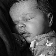 Oakley joined the competition — help win amazing prizes! baby, sleeping, infant, black_and_white, close_up, face, soft_lighting, peaceful, cozy, child, portrait, newborn, clothing, pattern, floral, cute, resting, head, skin, young