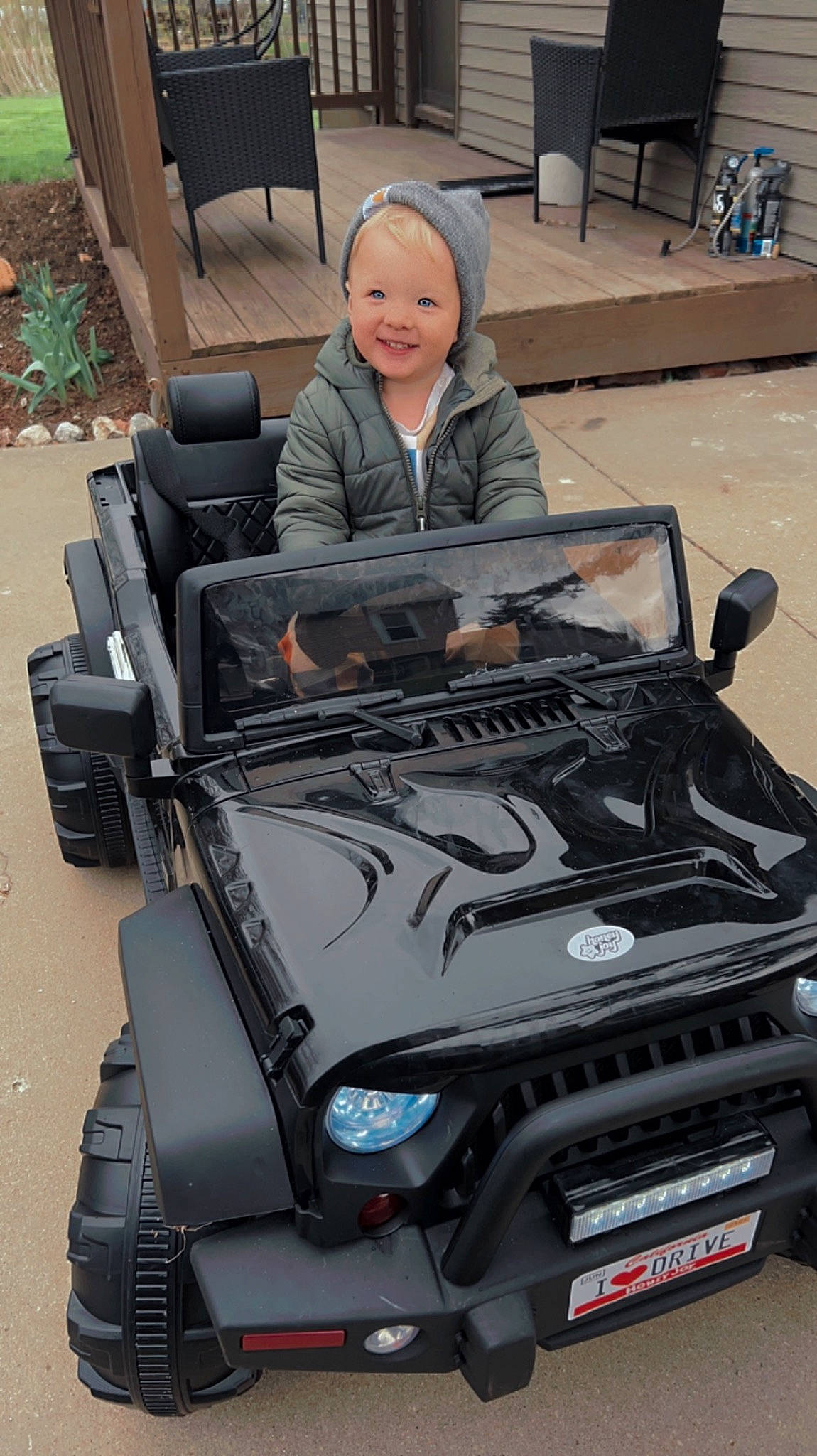 Finnegan is registered to the contest to win money with this photo: automotive_design, automotive_exterior, automotive_lighting, automotive_tire, automotive_wheel_system, automotive_window_part, bumper, car, chair, fender, grille, headlamp, hood, joy, motor_vehicle, person, rim, smile, tire, vehicle