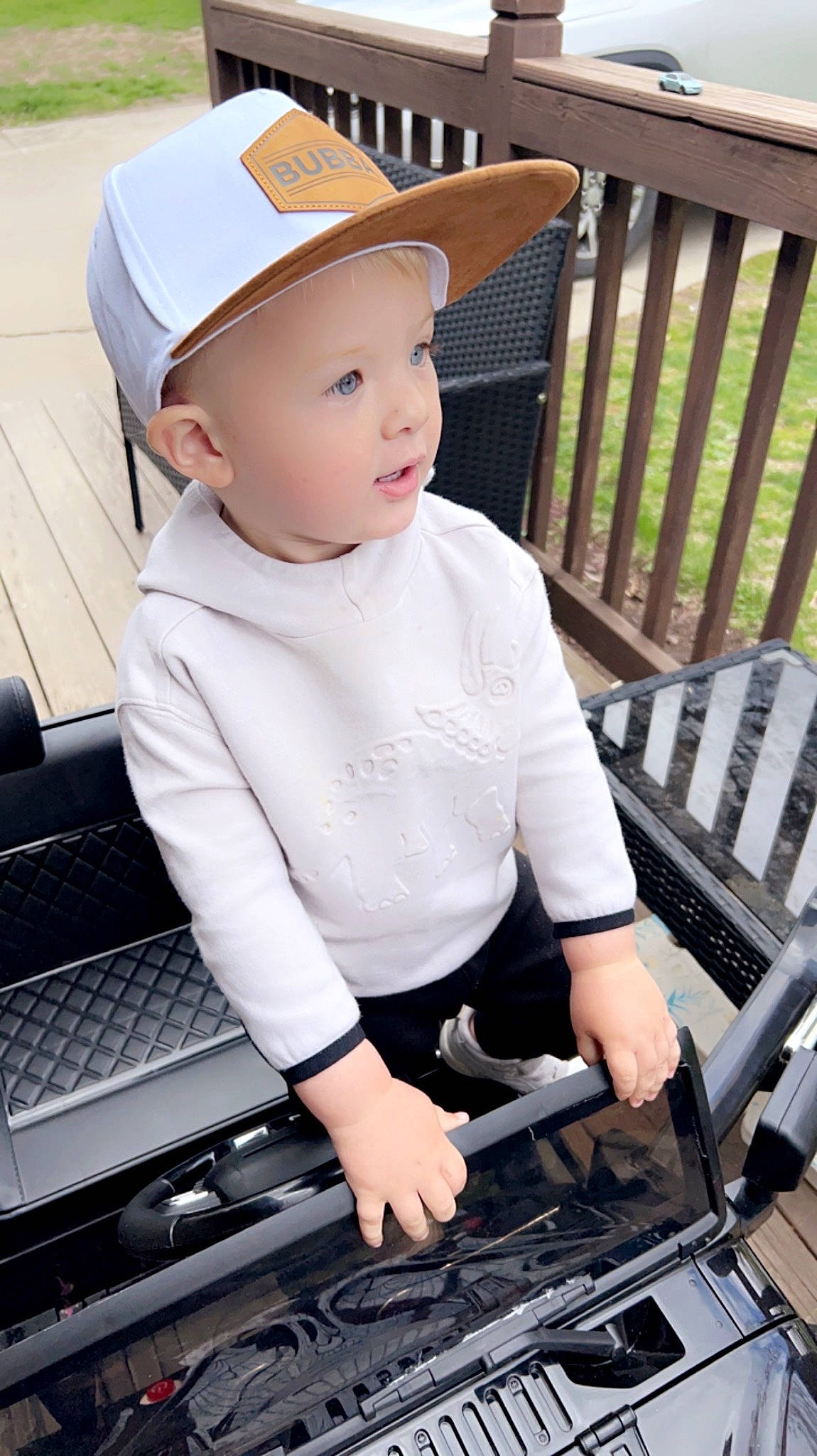 Finnegan joined the competition — help win amazing prizes! baby, baby_products, baby_toddler_clothing, black, cap, chair, child, cooking, fashion_accessory, grass, hat, headwear, office_equipment, outdoor_furniture, pattern, person, sitting, sleeve, smile, t_shirt