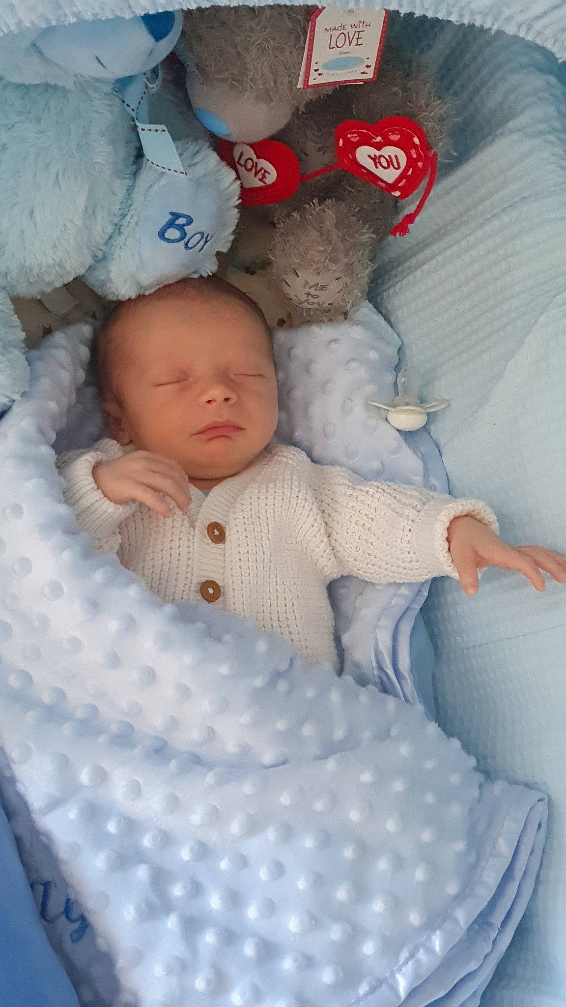 Ollie joined the competition — help win amazing prizes! baby, baby_products, baby_safety, baby_sleeping, baby_toddler_clothing, baseball_cap, bedtime, cap, carmine, cheek, child, comfort, infant_bed, linens, pattern, person, product, skin, textile, toddler