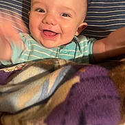 Erick is registered to the contest to win money with this photo: baby, babylaughing, bed, bedroom, blanket, cushion, face, furniture, happy, head, homedecor, indoors, laughing, newborn, person, photography, portrait, quilt, room, smile