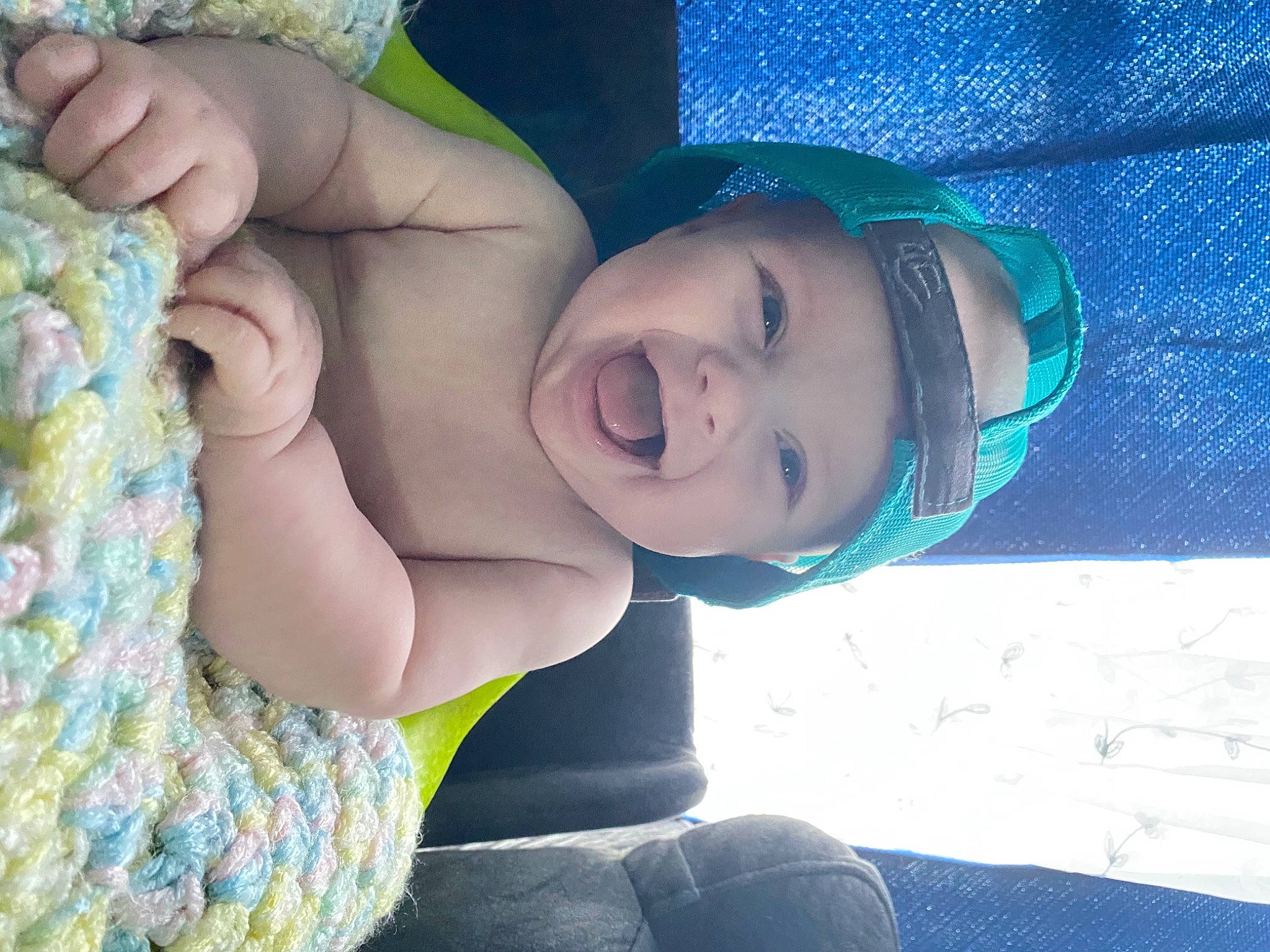 Flynn joined the competition — help win amazing prizes! aqua, azure, baby, baby_toddler_clothing, blue, cap, chest, child, fun, grass, green, happy, hat, headwear, leisure, mouth, neck, person, skin, smile