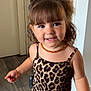 toddler, child, smiling, leopard_print, hair_bow, jewelry, earrings, necklace, indoor, flooring, motion, happy, cute, portrait, person, young_child, fashion, accessories, skin, face
