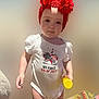 toddler, child, baby, onesie, headband, red_flowers, standing, indoor, carpet, holding_object, yellow_bottle, white_clothing, sock, footwear, cute, portrait, celebration, holiday, 4th_of_july, innocent