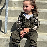 Kingston joined the competition — help win amazing prizes! child, toddler, sitting, steps, concrete, camo_jacket, pants, nike_sneakers, shoes, hair_tied, outdoor, sunlight, casual_clothing, person, fashion, street_style, young_child, portrait, curious, daylight