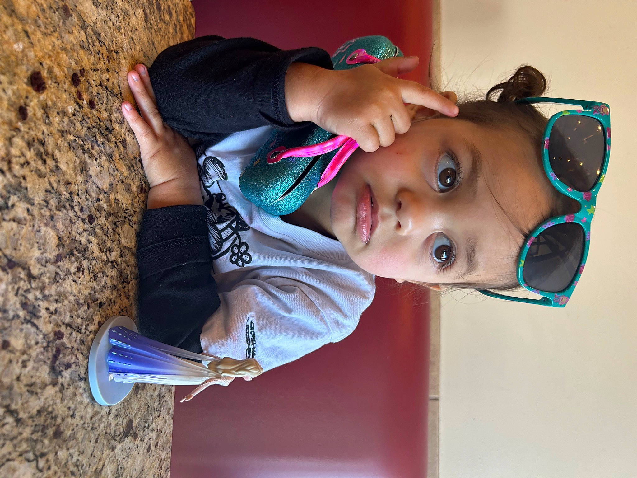Vada is registered to the contest to win money with this photo: arm, baby, child, elbow, electric_blue, eyewear, fun, glasses, happy, hat, headwear, leisure, nose, person, recreation, smile, sunglasses, t_shirt, toddler, tree