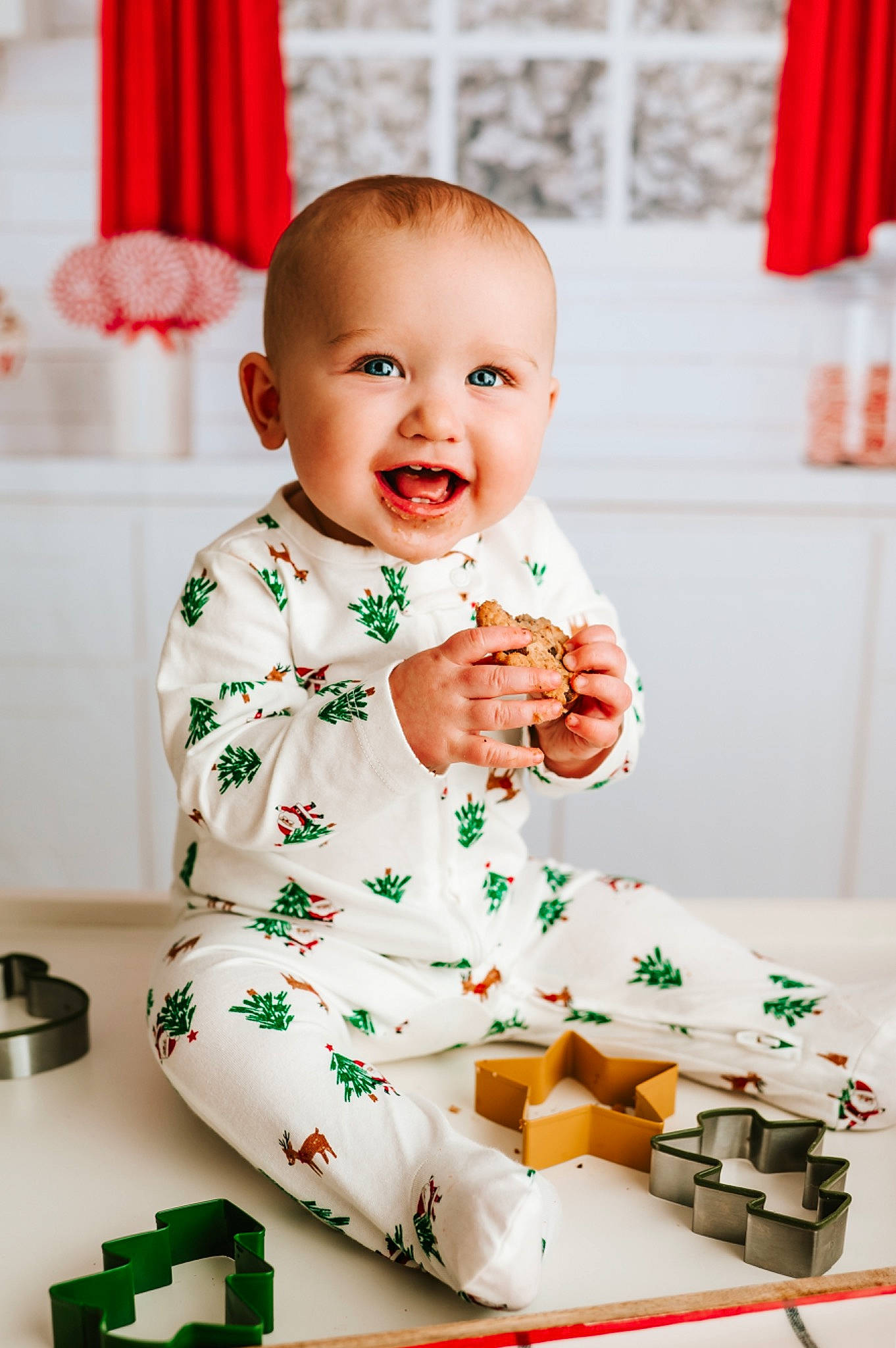 Jensen is registered to the contest to win money with this photo: baby, baby_toddler_clothing, carmine, child, curtain, event, fun, green, happy, holiday, orange, person, portrait_photography, red, room, sitting, sleeve, smile, toddler, white