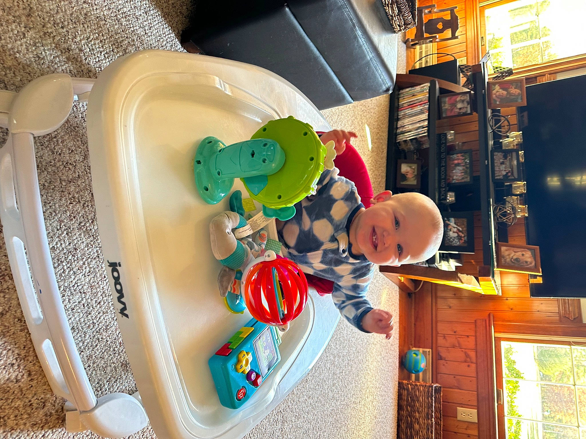 Jensen is registered to the contest to win money with this photo: baby, baby_products, baby_toys, child, circle, dishware, fun, games, joy, leisure, major_appliance, person, plate, play, product, recreation, room, serveware, shelf, tableware