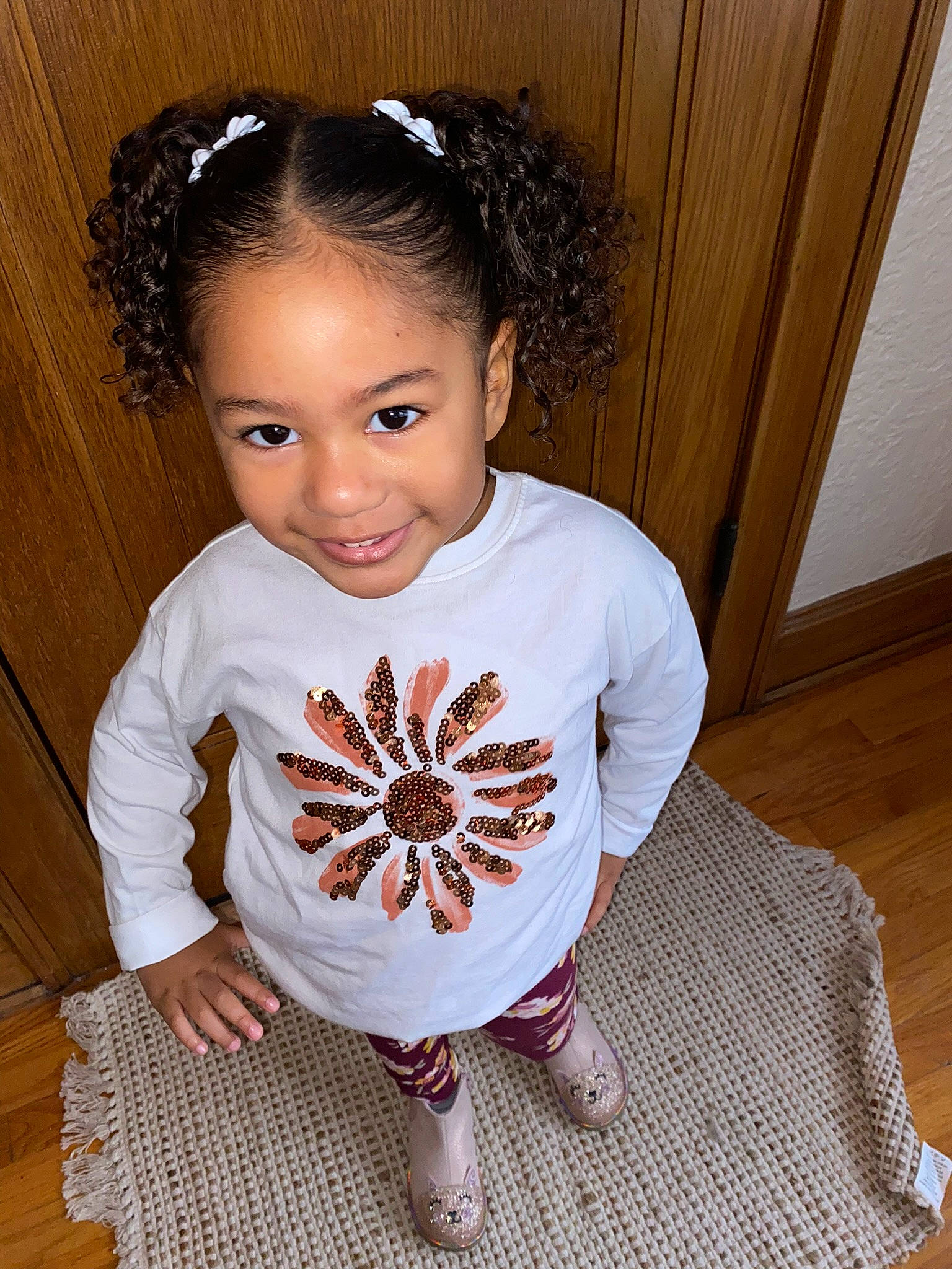 Leilani is registered to the contest to win money with this photo: baby_toddler_clothing, cheek, chin, clothing, cool, eyelash, facial_expression, fashion_accessory, flash_photography, flooring, hair, happy, jewellery, joy, neck, pattern, person, skin, sleeve, t_shirt