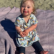 Jean Grey is registered to the contest to win money with this photo: barefoot, blanket, child, cute, daylight, dress, happy, leggings, outdoor, person, playful, pony_tail, portrait, sand, shadow, sitting, smiling, sunlight, toddler, young_child
