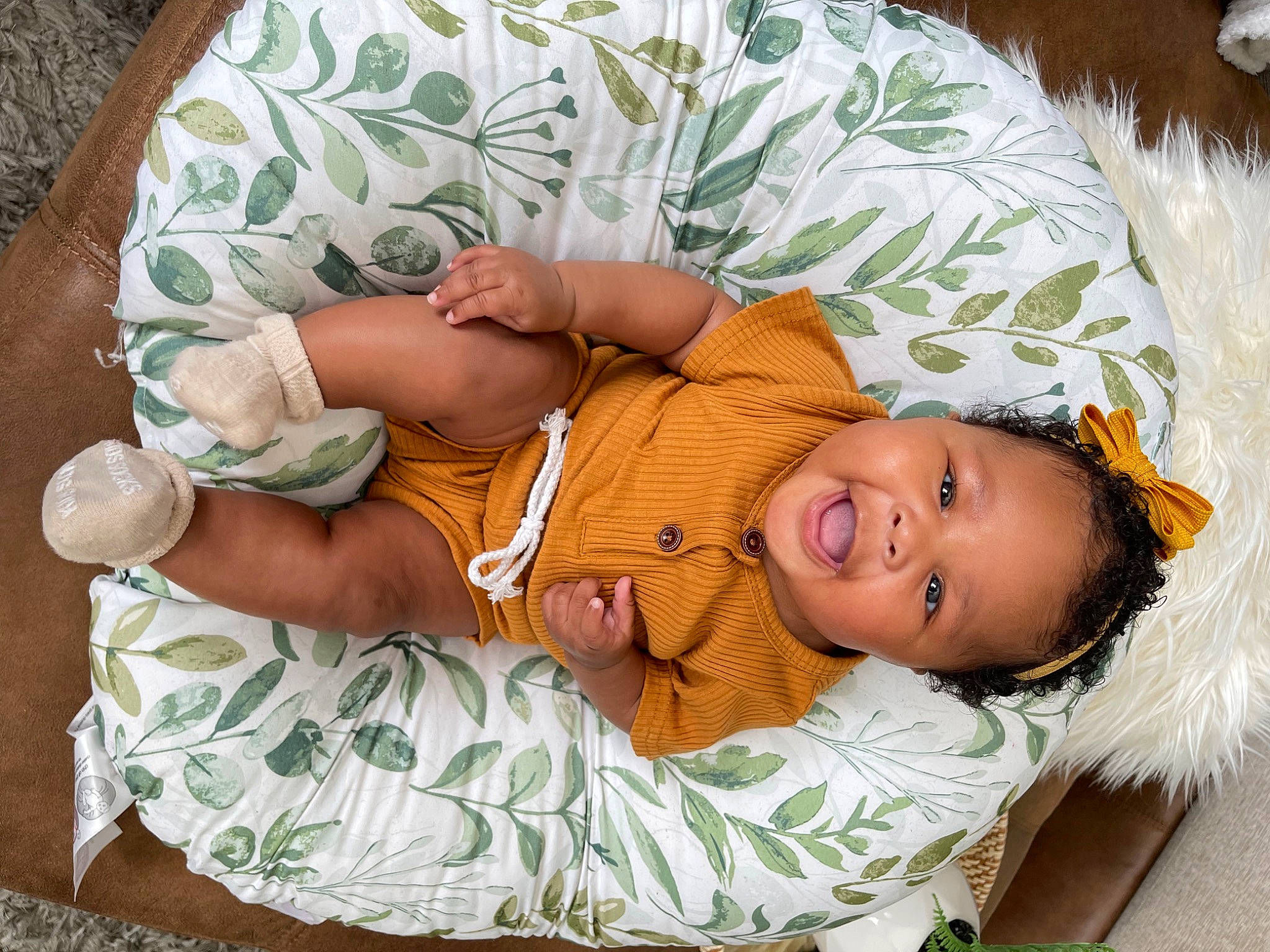 Nola joined the competition — help win amazing prizes! abdomen, arm, baby, baby_toddler_clothing, child, comfort, hand, happy, hat, head, human_body, lap, leg, linens, mammal, person, skin, sleeve, smile, toddler