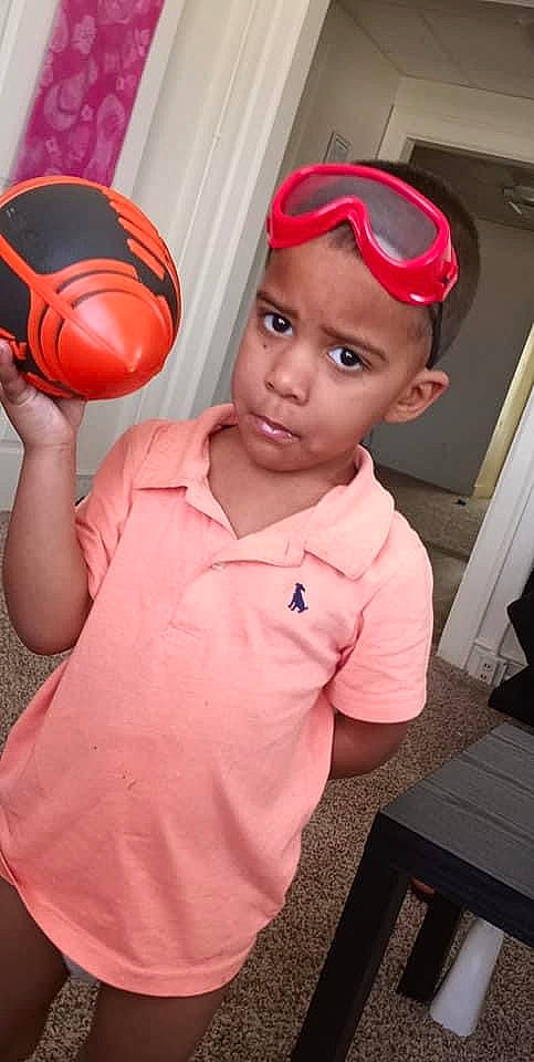 Darrius joined the competition — help win amazing prizes! basketball, cap, cheek, eyewear, fun, gesture, goggles, happy, headwear, mouth, nose, person, personal_protective_equipment, pink, red, sleeve, sports_equipment, standing, sunglasses, t_shirt
