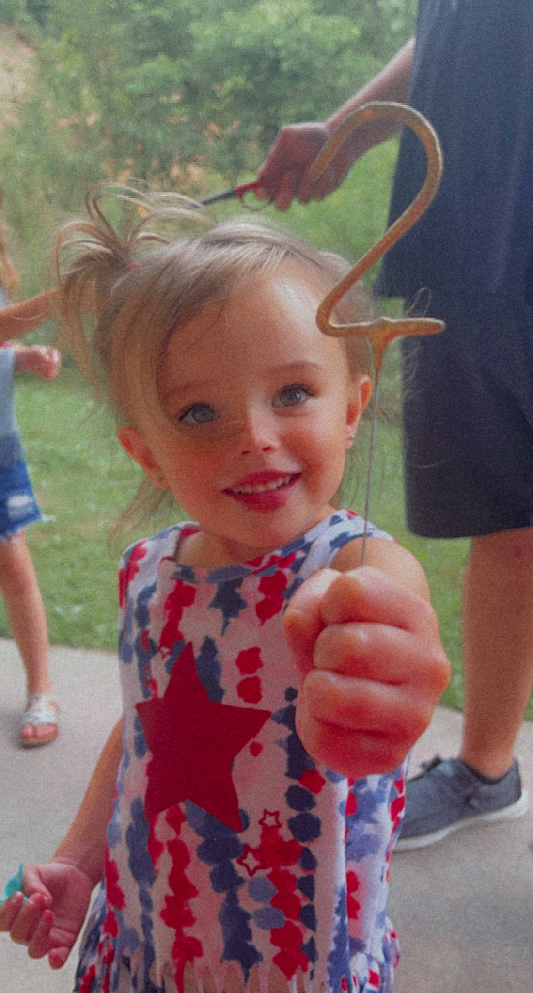 Raeleah is registered to the contest to win money with this photo: blond, child, clothing, cool, finger, gesture, grass, happy, iris, joy, leaf, leisure, person, pink, plant, shorts, skin, smile, textile, thumb