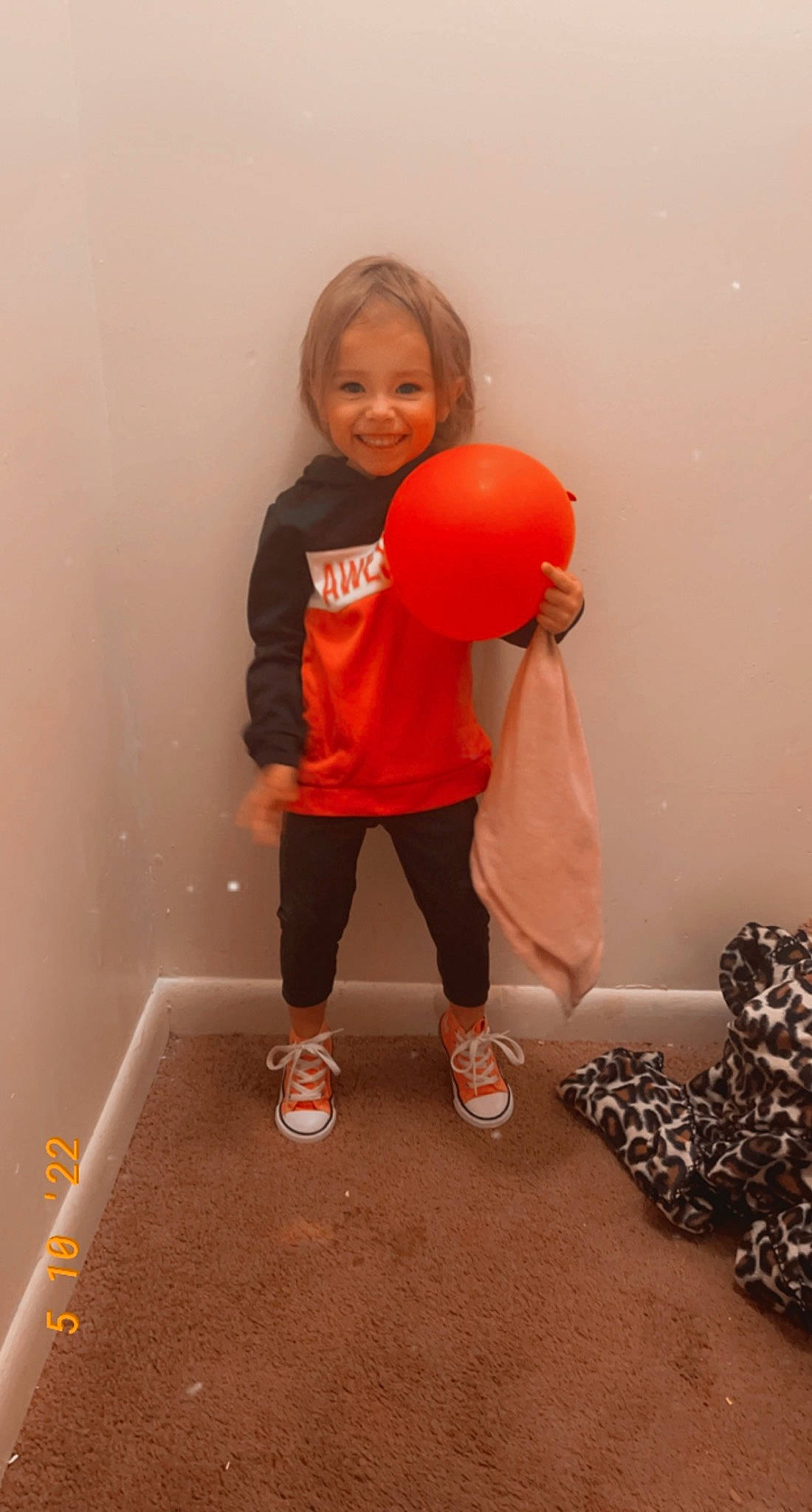 Raeleah is registered to the contest to win money with this photo: balloon, child, flooring, fun, happy, human_leg, joy, knee, magenta, orange, party_supply, peach, person, physical_fitness, room, sleeve, smile, t_shirt, toddler