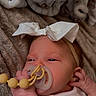 baby, beads, blanket, bow, close_up, clothing, comfort, cute, hand, headband, indoors, infant, newborn, pacifier, peaceful, portrait, resting, skin, sleepy, soft_toys